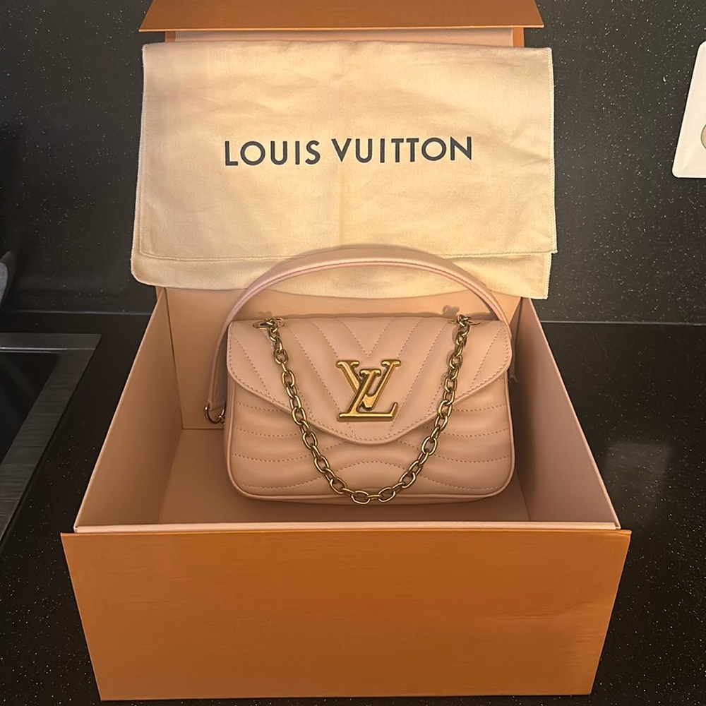 Louise Vuitton small pink bag. Brand New. Never worn. Original box & dust bag.
